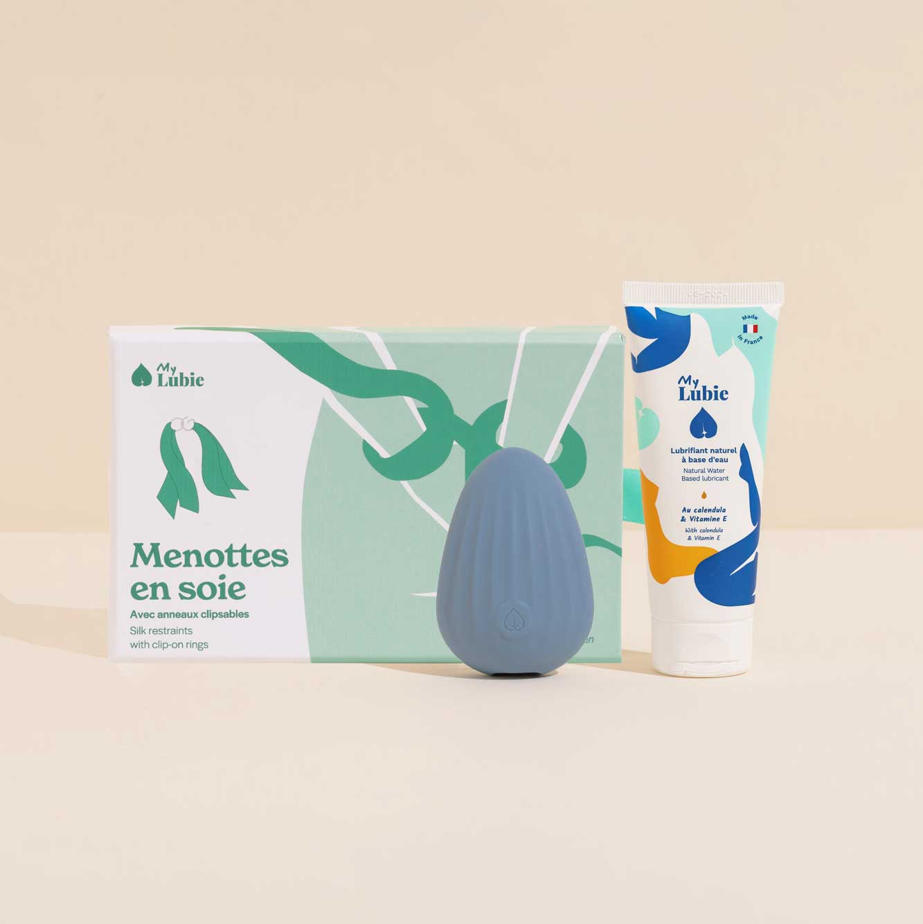 Vibes & vibrations, le coffret my lubie, avec menottes en soie, aura le stimulateur clitoridien, dune le galet vibrant, et le lubrifiant naturel fluide